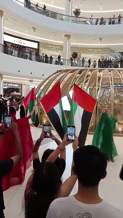 Guests on the dhow cruise with UAE flags